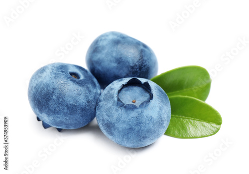 Fresh ripe blueberries with leaves on white background