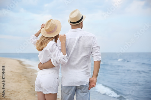 Happy couple having romantic walk on beach © New Africa