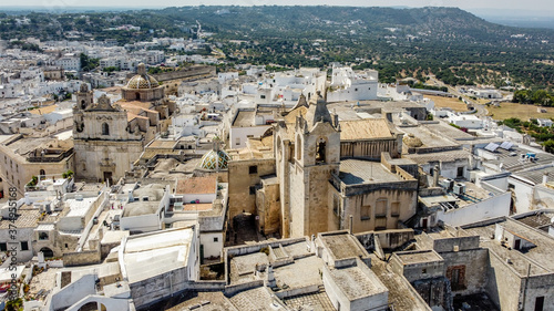 Aerial view of Ostuni "The White City" in Apulia, southern Italy - Romanesque cathedral and Church of Saint Vyth Martyr seen from above