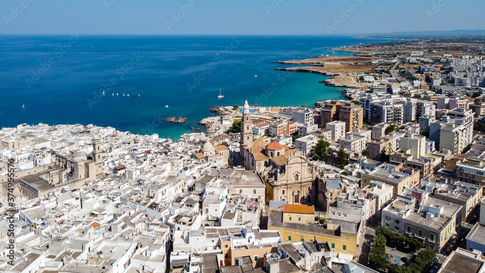 Aerial view of Monopoli in Apulia, south of Italy - Monopoli Cathedral aka Basilica of the Madonna della Madia from above, in front of the Adriatic Sea - Large view