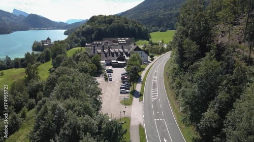  flight over the road overlooking the mountain forest and the big house