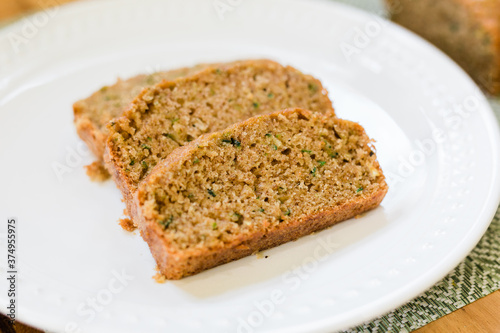 Slices of delicious and sweet Zucchini Bread on a White Plate