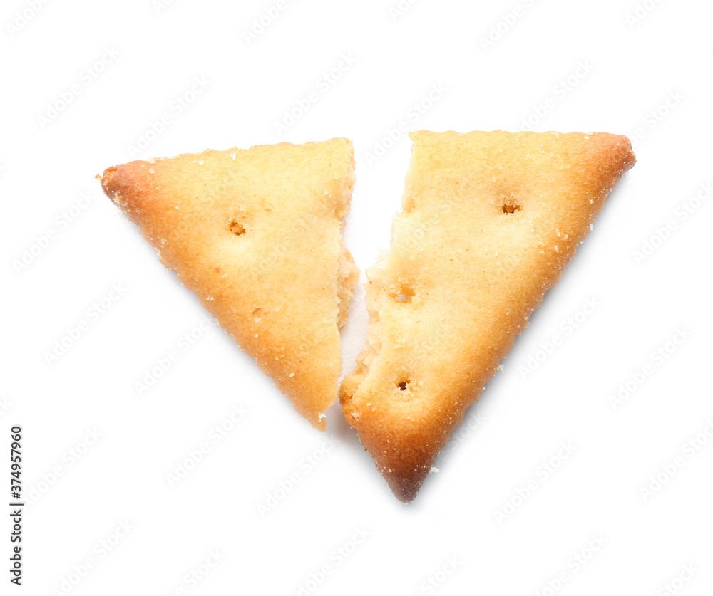 Fototapeta premium Broken delicious crispy cracker isolated on white, top view