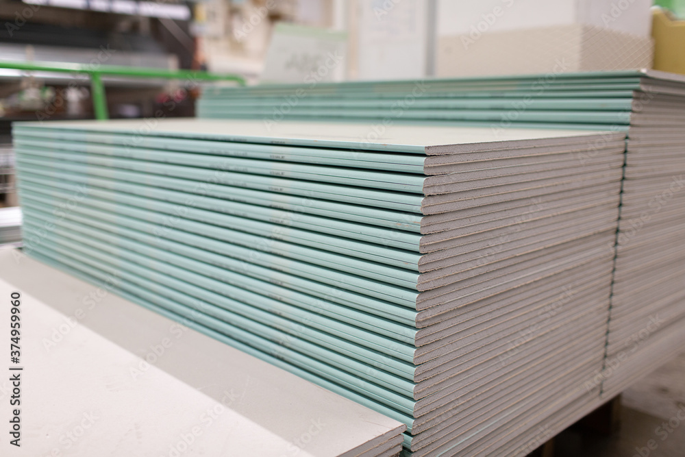 Pallet with Drywall sheets plasterboard in the building warehouse store.  Stock Photo | Adobe Stock