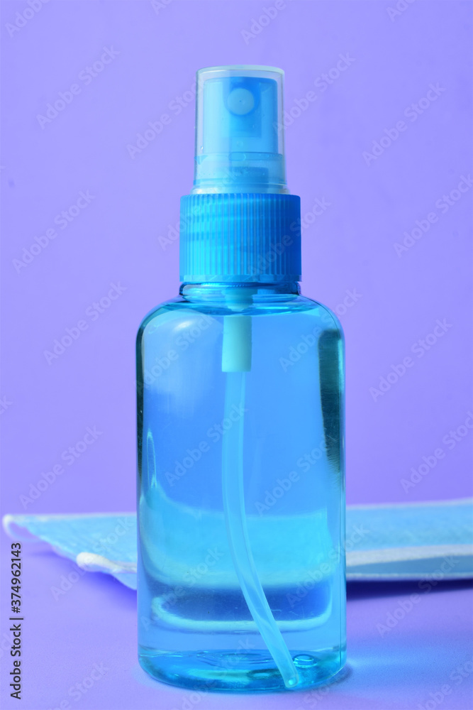 Close up, hygienic measures, hydroalcoholic gel and surgical masks, on a blue background Close up, hygienic measures, hydroalcoholic gel and surgical masks, on a blue background