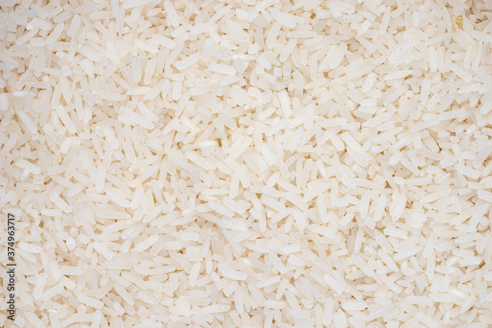 long grain rice pattern. top view jasmin rice background and texture. long grain rice pattern. top view jasmin rice background and texture.