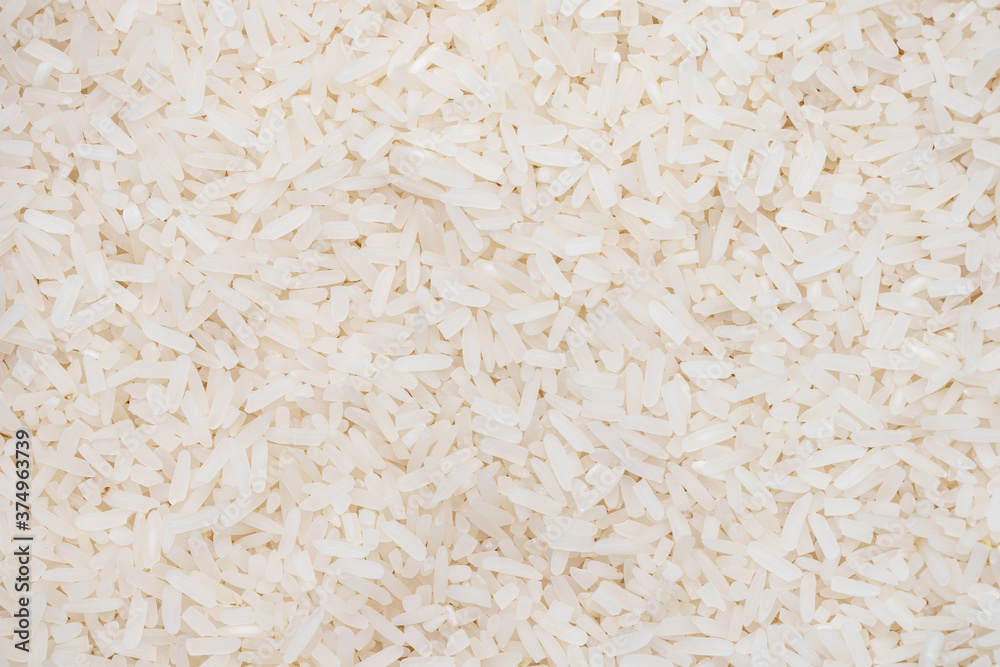 long grain rice pattern. top view jasmin rice background and texture. long grain rice pattern. top view jasmin rice background and texture.