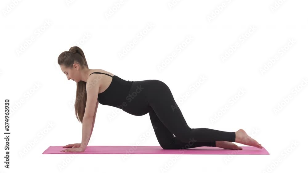 Pregnancy fitness. Pregnant woman knell down on mat and lifting leg. Isolated on white background. Pregnancy fitness. Pregnant woman knell down on mat and lifting leg. Isolated on white background.
