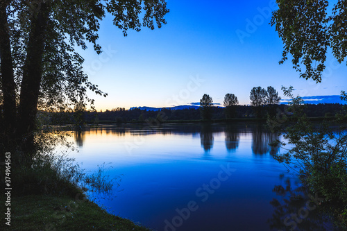 Obraz na płótnie Calm river on a Summers night w salonie