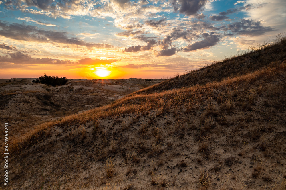 Beautiful morning desert landscape at sunrise with dunes.