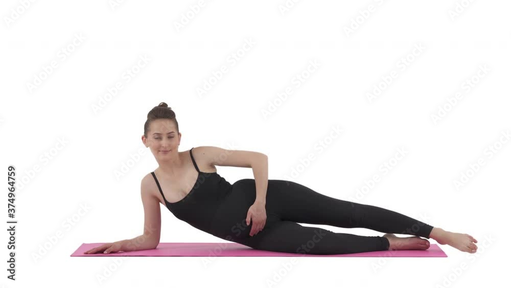 Pregnant Caucasian woman doing side lying leg lifts keeping head propped up with bottom hand. Pregnancy workout. Isolated on white background.