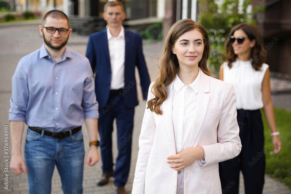 Different people walking on modern city street Different people walking on modern city street