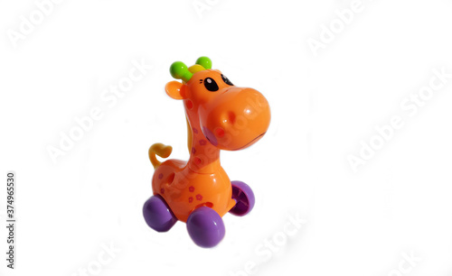 toy orange giraffe on wheels on a white background. animal zoo child play