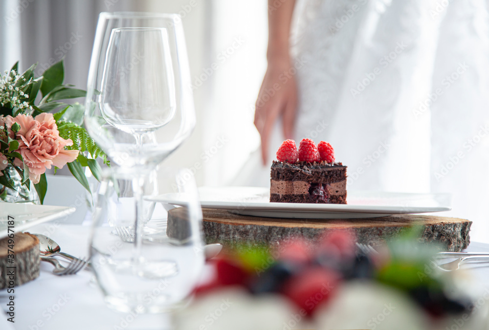 wedding table setting with wedding dress in the background wedding table setting with wedding dress in the background