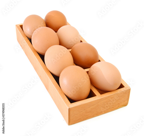 eggs in wooden box on a white background