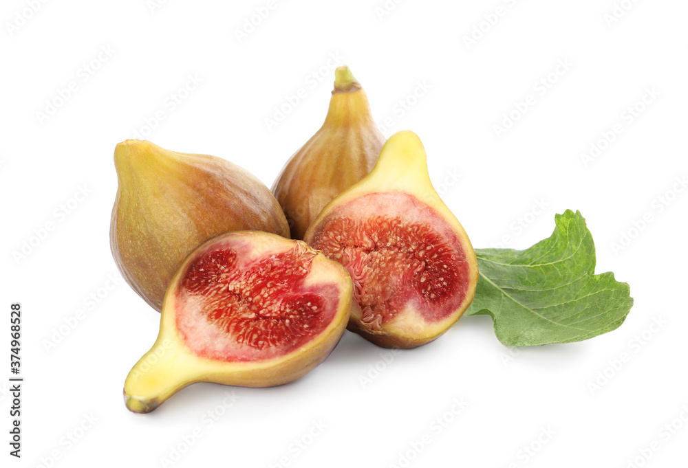 Tasty ripe figs and green leaf isolated on white Tasty ripe figs and green leaf isolated on white