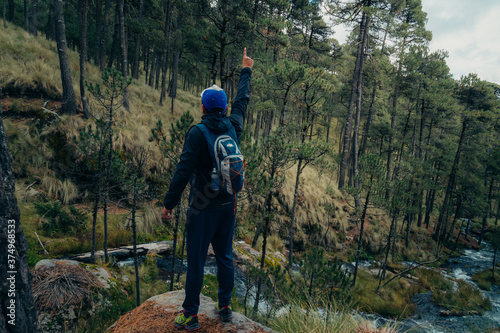 A man enjoying the beauty waterfall in the zta-Popo Zoquiapan National Park photo