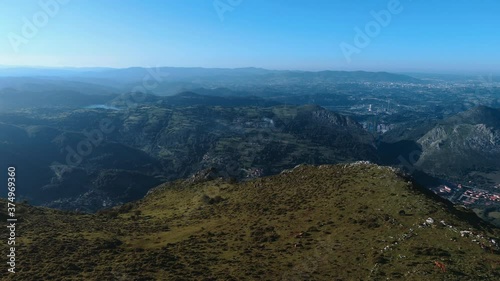 Aerial view of a slow forward movement on the top of a mountain