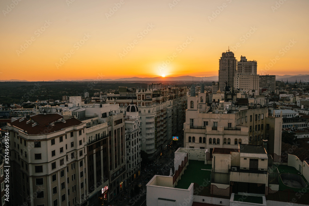 sunset of gran via in the city of madrid
