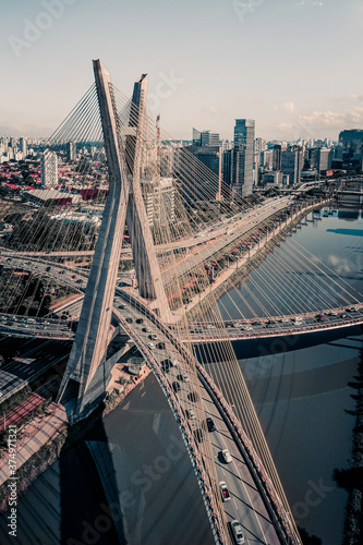 Aerial View Of Pinheiros River And Cable Stay Bridge During Peak Hour In Central Business District Of Sao Paulo, Brazil photo