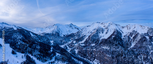 Panoramic aerial view of snowy mountains in Les Orres, France