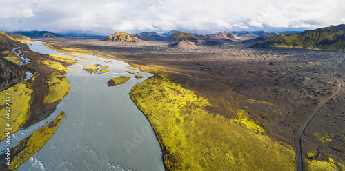 Panoramic aerial view of river Tungnaa  and 4WD road F208 between the mountains in beautiful sunlight, Fjallabak nature reserve, highlands of Iceland photo