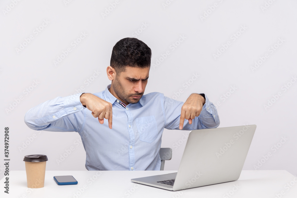 Do immediately, here and right now! Angry boss pointing fingers down giving order to employees talking on video call, showing authority on online conference. studio shot isolated on white background Do immediately, here and right now! Angry boss pointing fingers down giving order to employees talking on video call, showing authority on online conference. studio shot isolated on white background