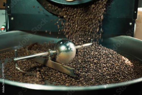 Close up photo of coffee roasting machine in process.