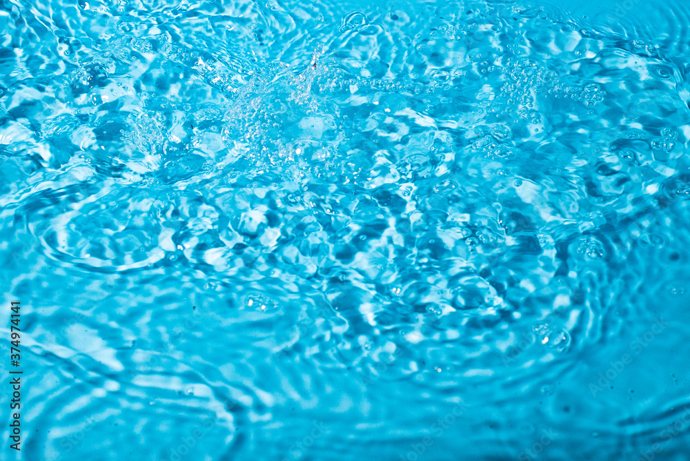 splash of water on a blue background. Abstract wallpaper