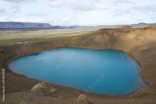 Emerald blue colored water of circular lake in Crater Víti (hell) at Krafla volcanic area, Mývatn region, Northeastern Iceland, Scandinavia