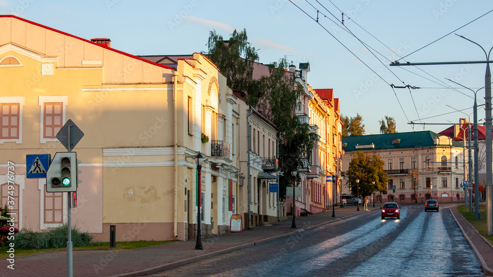 Grodno, Belarus, August 25, 2020:  Street of the old city against the background of the evening sky.