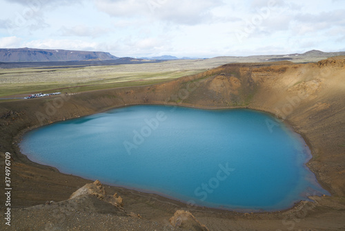 Emerald blue colored water of circular lake in Crater Víti (hell) at Krafla volcanic area, Mývatn region, Northeastern Iceland, Scandinavia