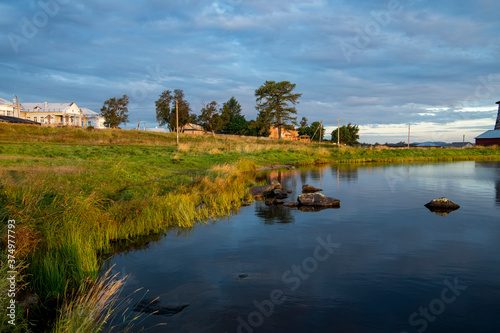 landscape of the north island at dawn against the background of ancient houses