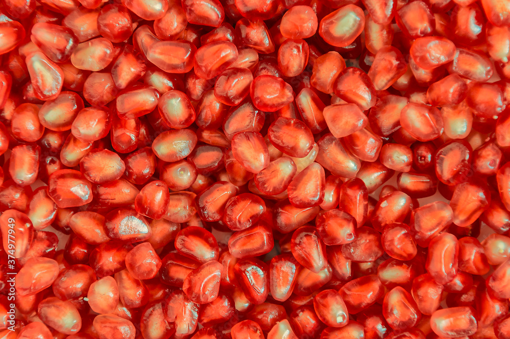 Background of fresh pomegranate seeds. Close-up. Background of fresh pomegranate seeds. Close-up.