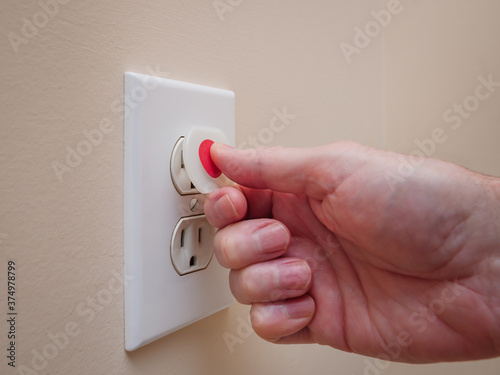 Konstfotografi Electrical outlet with electricity safety cover to prevent child electrocution