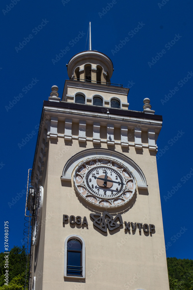 Fototapeta premium the clock tower in the village of Rosa Khutor, Sochi