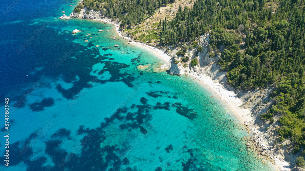 Obraz premium Aerial photo taken by drone of Caribbean tropical exotic steep cliff island bay with turquoise clear sea sandy beaches and rare limestone trees