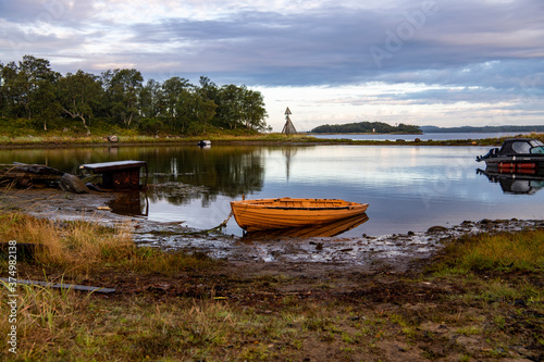Fototapeta Naklejka Na Ścianę i Meble -  landscape of the island against the background of old wooden boats lying on the shore