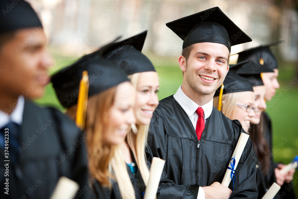Graduation: Handsome Graduate Looks at Camera Graduation: Handsome Graduate Looks at Camera