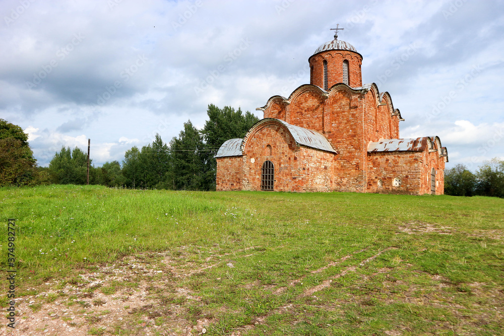 Beautiful medieval church of the Savior on Kovalevo with red walls near Velikiy (Great) Novgorod, Russia