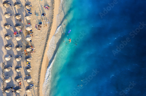 Mediterranean sea. Aerial view on the beach and people. Vacation and adventure. Beach and blue water. Top view from drone at beach and azure sea. Travel and relax - image