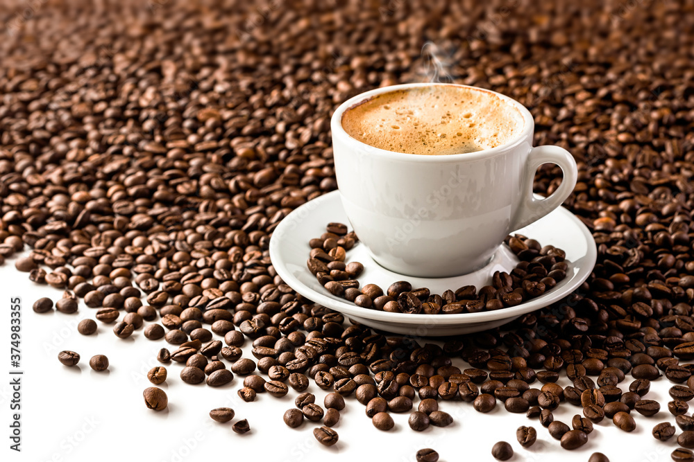 Cup with coffee on the background of coffee beans Cup with coffee on the background of coffee beans