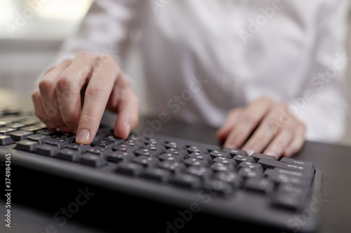  Female hands or woman office worker typing on the keyboard