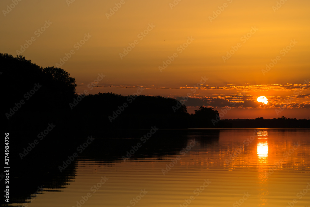 Beautiful sunrise over the river, lake.