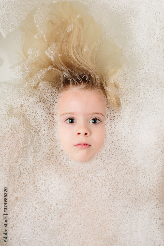 girl washing her hair in bubble bath girl washing her hair in bubble bath