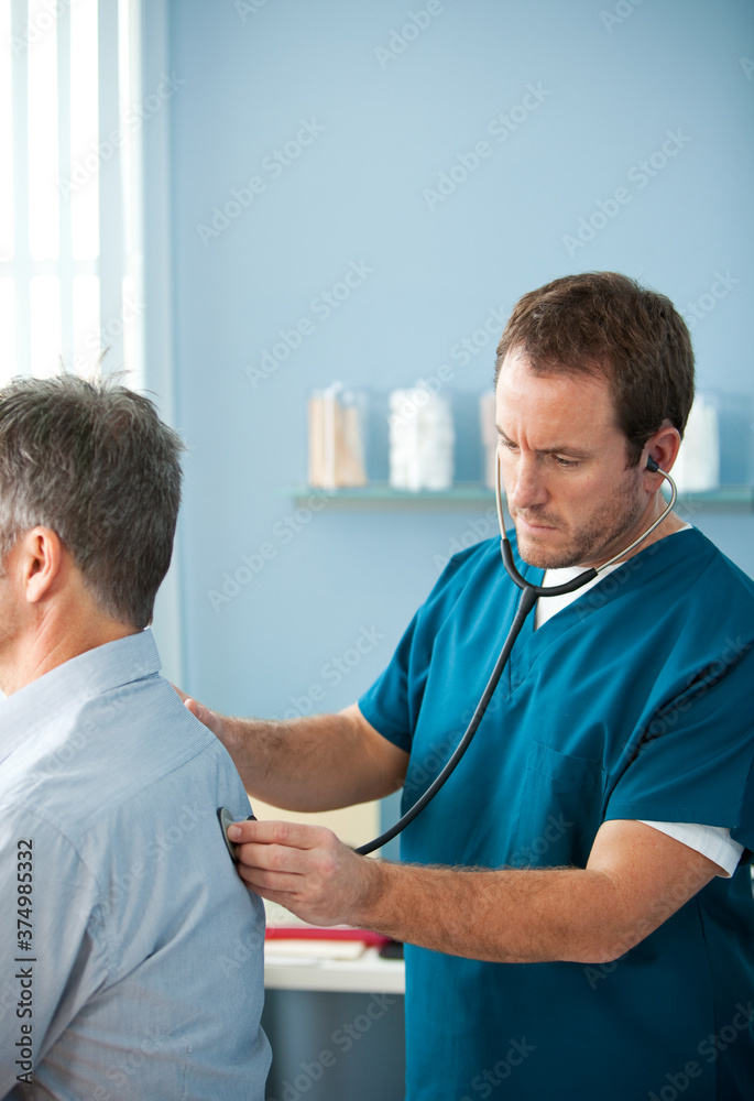 Exam Room: Male Nurse with Patient Exam Room: Male Nurse with Patient