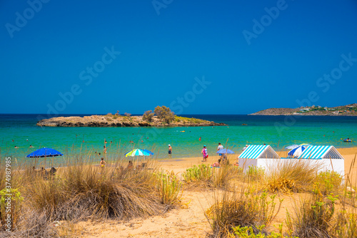 Fototapeta Naklejka Na Ścianę i Meble -  Sandy beach of Kalathas with the picturesque islet in Akrotiri Chania, Crete, Greece.