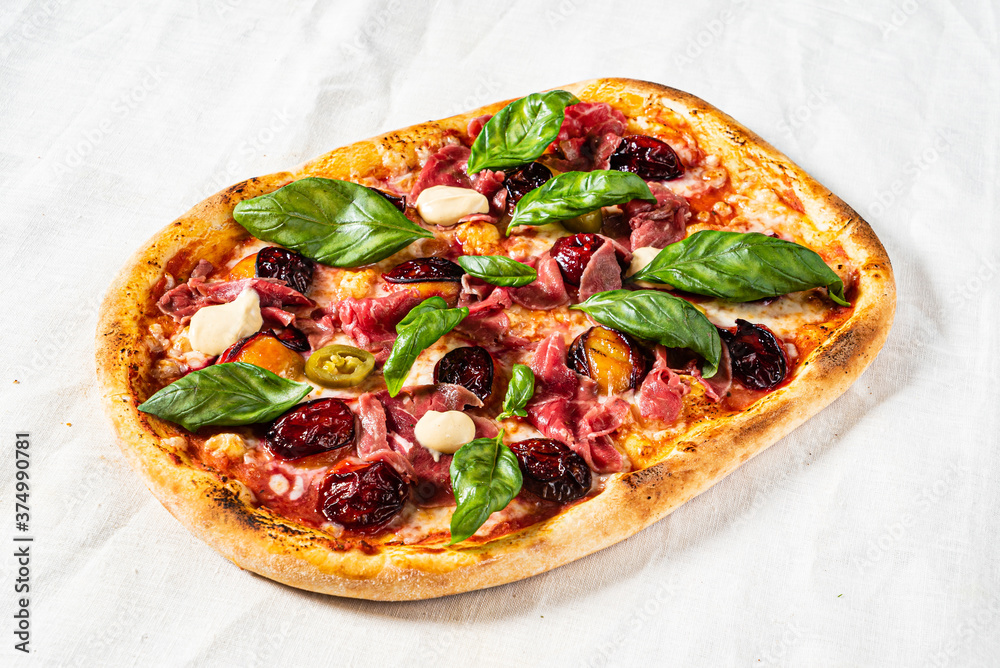 creative pizza with beef and cherries