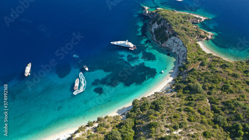 Aerial drone photo of beautiful paradise steep cliff sandy beach of Gidaki accessible by short hiking in beautiful Ionian island of Ithaki or Ithaca, Greece