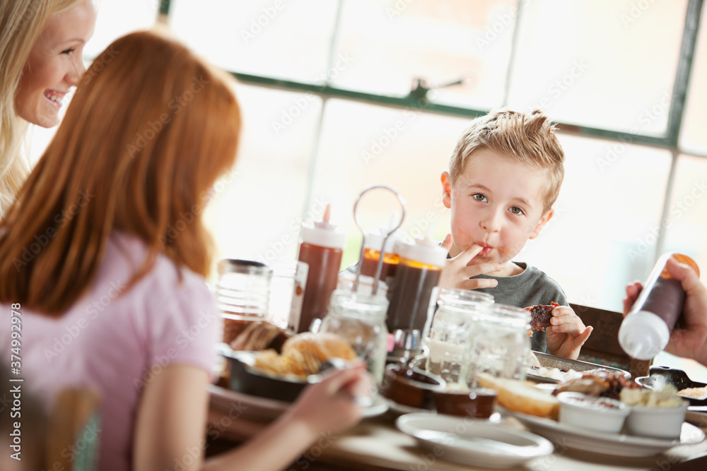 Barbeque: Little Boy Licks Sauce From Fingers Barbeque: Little Boy Licks Sauce From Fingers